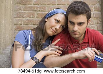Stock Photo - woman resting 
head on man's 
shoulder. fotosearch 
- search stock 
photos, pictures, 
images, and photo 
clipart