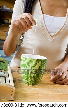 Stock Photo - woman with mug 
of tea. fotosearch 
- search stock 
photos, pictures, 
images, and photo 
clipart