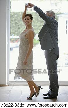 Stock Photo - happy couple dancing. 
fotosearch - search 
stock photos, 
pictures, images, 
and photo clipart