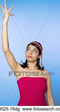 Stock Photo - woman with arm 
raised. fotosearch 
- search stock 
photos, pictures, 
images, and photo 
clipart