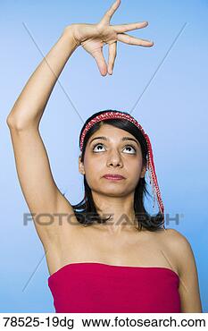 Stock Photo - woman with arm 
raised. fotosearch 
- search stock 
photos, pictures, 
images, and photo 
clipart