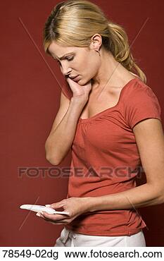 Stock Photo - woman with pregnancy 
test. fotosearch 
- search stock 
photos, pictures, 
images, and photo 
clipart