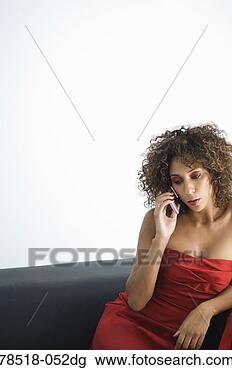 Stock Photo - woman in red dress 
talking on cell 
phone. fotosearch 
- search stock 
photos, pictures, 
images, and photo 
clipart