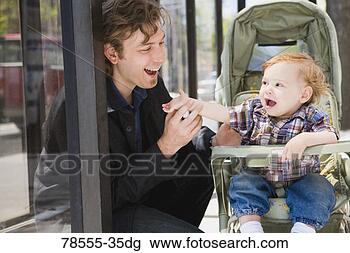 Stock Photo - father with son 
in a stroller. 
fotosearch - search 
stock photos, 
pictures, images, 
and photo clipart