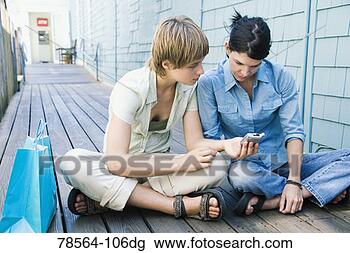 Stock Photo - friends looking 
at camera on boardwalk. 
fotosearch - search 
stock photos, 
pictures, images, 
and photo clipart