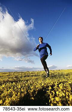 Stock Photo - man running in 
a field of flowers. 
fotosearch - search 
stock photos, 
pictures, images, 
and photo clipart