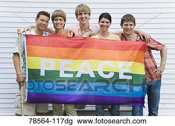 Stock Photo - portrait of friends 
holding rainbow 
peace flag. fotosearch 
- search stock 
photos, pictures, 
images, and photo 
clipart