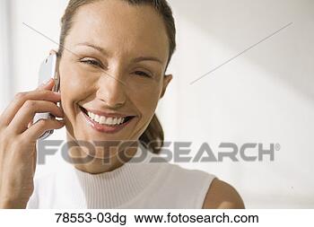 Stock Photo - woman using cell 
phone. fotosearch 
- search stock 
photos, pictures, 
images, and photo 
clipart