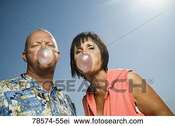 Stock Photo - couple blowing 
bubble gum bubbles. 
fotosearch - search 
stock photos, 
pictures, images, 
and photo clipart