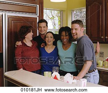 Stock Photo - portrait of five 
people standing 
in a kitchen. 
fotosearch - search 
stock photos, 
pictures, images, 
and photo clipart