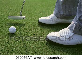 Stock Photo - close-up of a 
putter, golf ball, 
and golfer's shoes 
on a golf course. 
fotosearch - search 
stock photos, 
pictures, images, 
and photo clipart