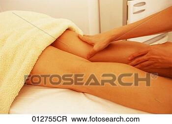 Stock Photo - a close-up of 
a woman getting 
her legs massaged, 
legs only. fotosearch 
- search stock 
photos, pictures, 
images, and photo 
clipart