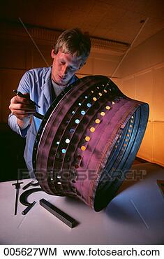 Stock Photo - man measuring 
specs on aircraft 
part. fotosearch 
- search stock 
photos, pictures, 
images, and photo 
clipart