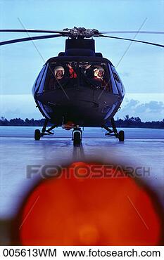 Stock Photo - pilots in helicopter 
cockpit preparing 
to takeoff. fotosearch 
- search stock 
photos, pictures, 
images, and photo 
clipart