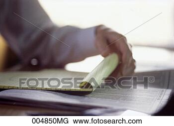 Stock Photo - hand holding a 
notepad, blurred. 
fotosearch - search 
stock photos, 
pictures, images, 
and photo clipart