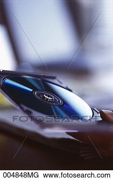 Stock Photo - man's hands holding 
an open compact 
disk case. fotosearch 
- search stock 
photos, pictures, 
images, and photo 
clipart