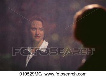 Stock Photo - reflection of 
a businesswoman 
in a window, blurred. 
fotosearch - search 
stock photos, 
pictures, images, 
and photo clipart