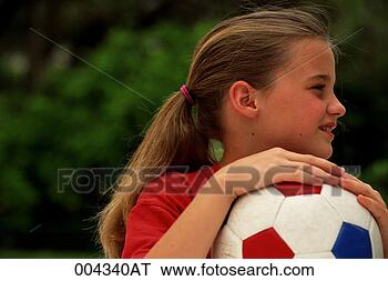 Stock Photo - girl with soccer 
ball looking sideways. 
fotosearch - search 
stock photos, 
pictures, images, 
and photo clipart