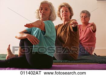 Stock Photo - three mature women 
sitting in a yoga 
pose. fotosearch 
- search stock 
photos, pictures, 
images, and photo 
clipart