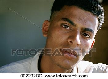 Stock Photo - serious young 
man. fotosearch 
- search stock 
photos, pictures, 
images, and photo 
clipart