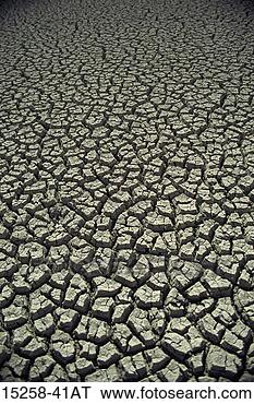 Stock Photo - cracked mud in 
a dry lake or 
river bed. fotosearch 
- search stock 
photos, pictures, 
images, and photo 
clipart