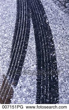 Stock Photo - tire tracks in 
the snow. fotosearch 
- search stock 
photos, pictures, 
images, and photo 
clipart