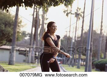 Stock Photo - woman jumping 
rope, motion blur. 
fotosearch - search 
stock photos, 
pictures, images, 
and photo clipart