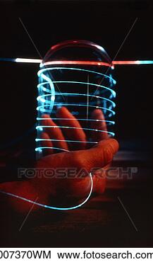 Stock Photo - man's hand holding 
a fiber optic 
light. fotosearch 
- search stock 
photos, pictures, 
images, and photo 
clipart