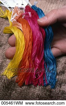 Stock Photo - hand holding samples 
of carpet yarn. 
fotosearch - search 
stock photos, 
pictures, images, 
and photo clipart