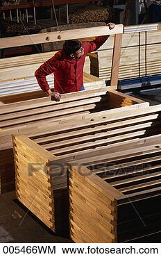 Stock Photo - man inspecting 
wooden door frames. 
fotosearch - search 
stock photos, 
pictures, images, 
and photo clipart