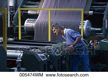 Stock Photo - man monitoring 
fabric in a textile 
mill. fotosearch 
- search stock 
photos, pictures, 
images, and photo 
clipart
