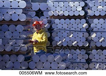 Stock Photo - man inventorying 
ingots of aluminum. 
fotosearch - search 
stock photos, 
pictures, images, 
and photo clipart