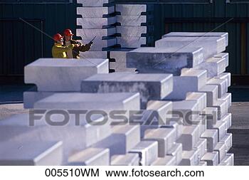 Stock Photo - men standing amongst 
ingots of aluminum 
talking. fotosearch 
- search stock 
photos, pictures, 
images, and photo 
clipart