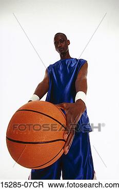 Stock Photo - a basketball player 
holding a basketball. 
fotosearch - search 
stock photos, 
pictures, images, 
and photo clipart