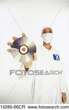 Stock Photo - a clean room technician 
holding a cd. 
fotosearch - search 
stock photos, 
pictures, images, 
and photo clipart