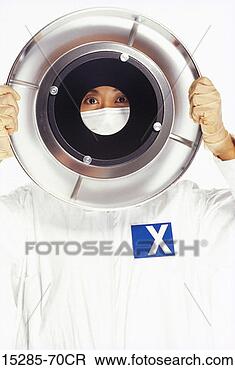 Stock Photo - a clean room technician 
holding a computer 
part. fotosearch 
- search stock 
photos, pictures, 
images, and photo 
clipart