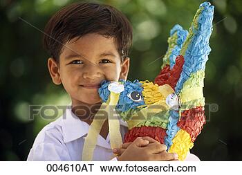 Stock Photo - boy holding a 
pi ata. fotosearch 
- search stock 
photos, pictures, 
images, and photo 
clipart