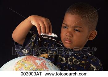 Stock Photo - boy moving toy 
space shuttle 
around a globe. 
fotosearch - search 
stock photos, 
pictures, images, 
and photo clipart