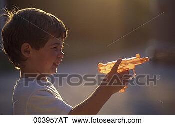 Stock Photo - boy shooting a 
water pistol. 
fotosearch - search 
stock photos, 
pictures, images, 
and photo clipart