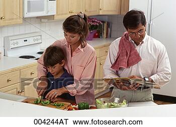Stock Photo - family preparing 
food. fotosearch 
- search stock 
photos, pictures, 
images, and photo 
clipart