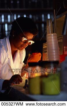 Stock Photo - woman testing 
color pigments 
used in plastics. 
fotosearch - search 
stock photos, 
pictures, images, 
and photo clipart