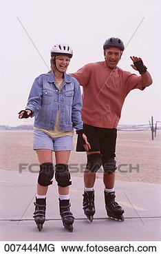Stock Photo - couple in-line 
skating. fotosearch 
- search stock 
photos, pictures, 
images, and photo 
clipart