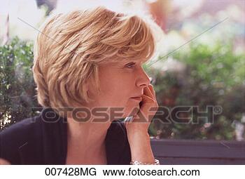 Stock Photo - profile of woman 
with her hand 
on chin. fotosearch 
- search stock 
photos, pictures, 
images, and photo 
clipart