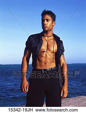 Stock Photo - man in open black 
shirt and black 
pants,  standing 
on ocean pier. 
fotosearch - search 
stock photos, 
pictures, images, 
and photo clipart
