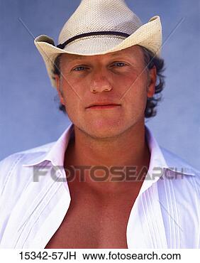 Stock Photo - man wearing cowboy 
hat, headshot 
outdoors. fotosearch 
- search stock 
photos, pictures, 
images, and photo 
clipart