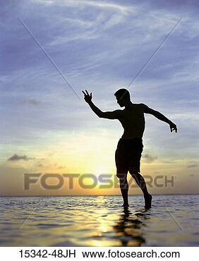 Stock Photo - silhouette of 
man posing, standing 
in ocean, belize. 
fotosearch - search 
stock photos, 
pictures, images, 
and photo clipart