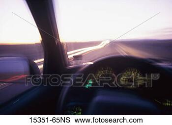 Stock Photo - car dashboard 
view of road with 
light streaks 
from passing traffic 
at. fotosearch 
- search stock 
photos, pictures, 
images, and photo 
clipart
