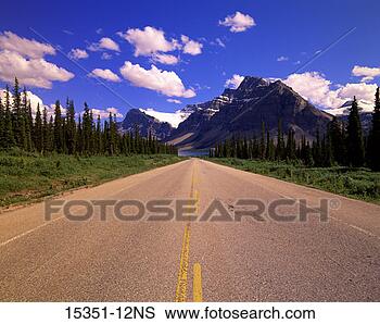 Stock Photo - highway approaching 
lake and mountains, 
banff national 
park, canada. 
fotosearch - search 
stock photos, 
pictures, images, 
and photo clipart