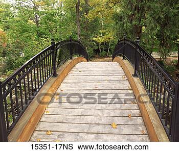 Stock Photo - wooden footbridge 
over stream in 
lithia park, ashland, 
oregon, usa. fotosearch 
- search stock 
photos, pictures, 
images, and photo 
clipart