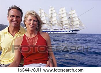 Stock Photo - prime couple posing, 
 with clipper 
ship sailing in 
tyrrhenian sea 
in. fotosearch 
- search stock 
photos, pictures, 
images, and photo 
clipart